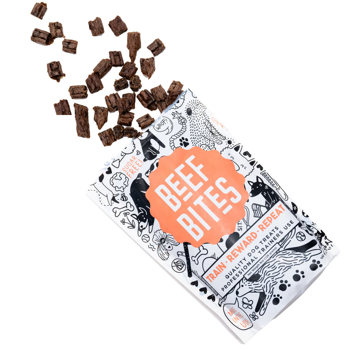 A package of Beef Bites dog and puppy training treats with a graphic design and some scattered treat pieces visible in front.